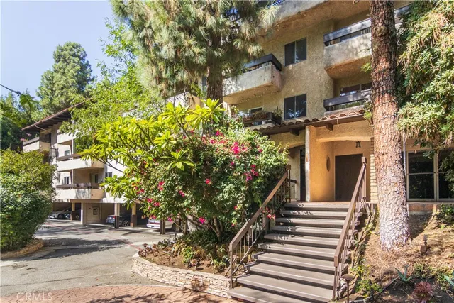 a view of a house with a tree