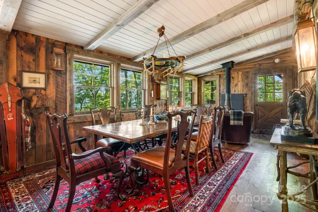a view of a dining room with furniture wooden floor and chandelier
