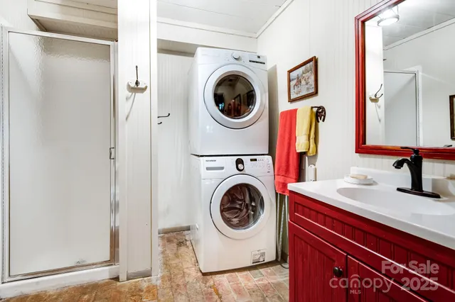 a utility room with sink dryer and washer