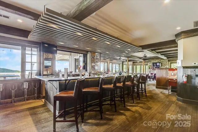 a view of a balcony with wooden floor
