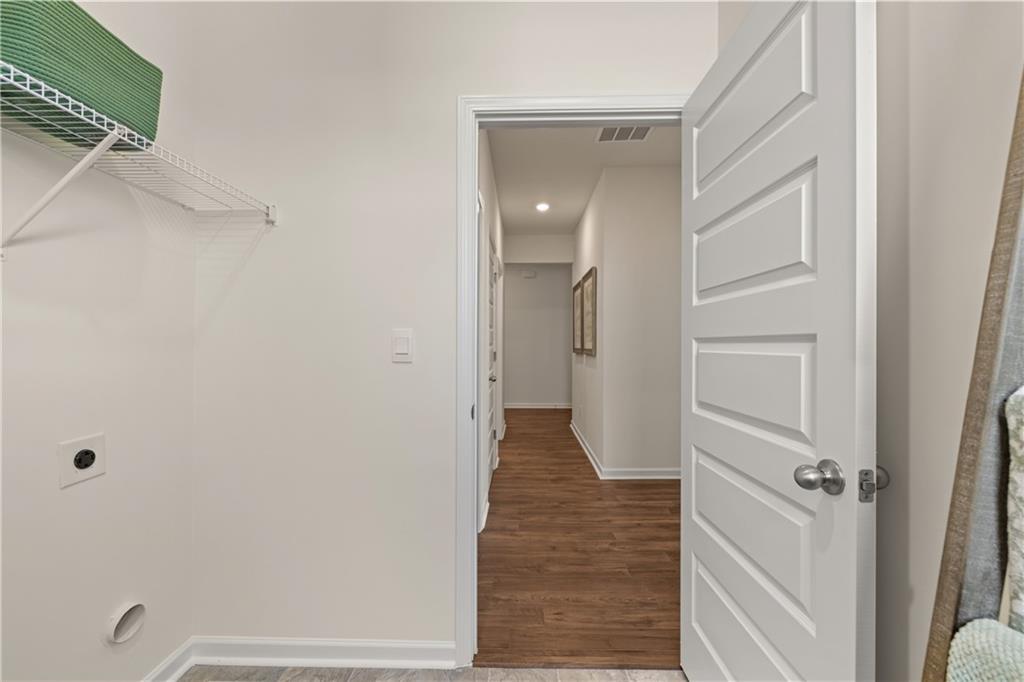 1160 Amerson Street Buckhead, GA 30625 - Photo 46 of 48 a view of a hallway with wooden floor and staircase