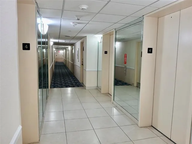 a view of a swimming pool with outdoor seating