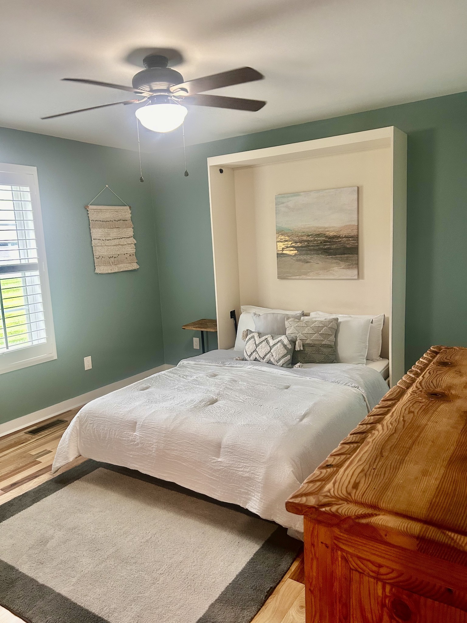 1059 South Cross Bridges Road Mount Pleasant, TN 38474 - Photo 16 of 53 a bedroom with a bed and a painting on the wall