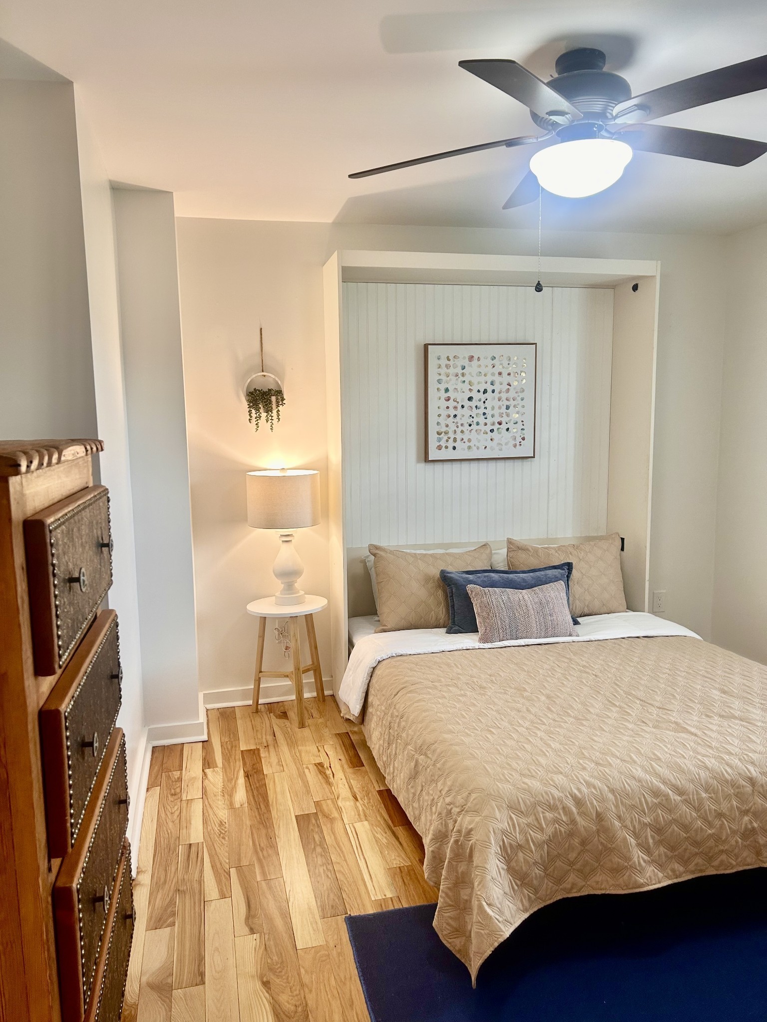 1059 South Cross Bridges Road Mount Pleasant, TN 38474 - Photo 17 of 53 a bedroom with a bed and a chandelier