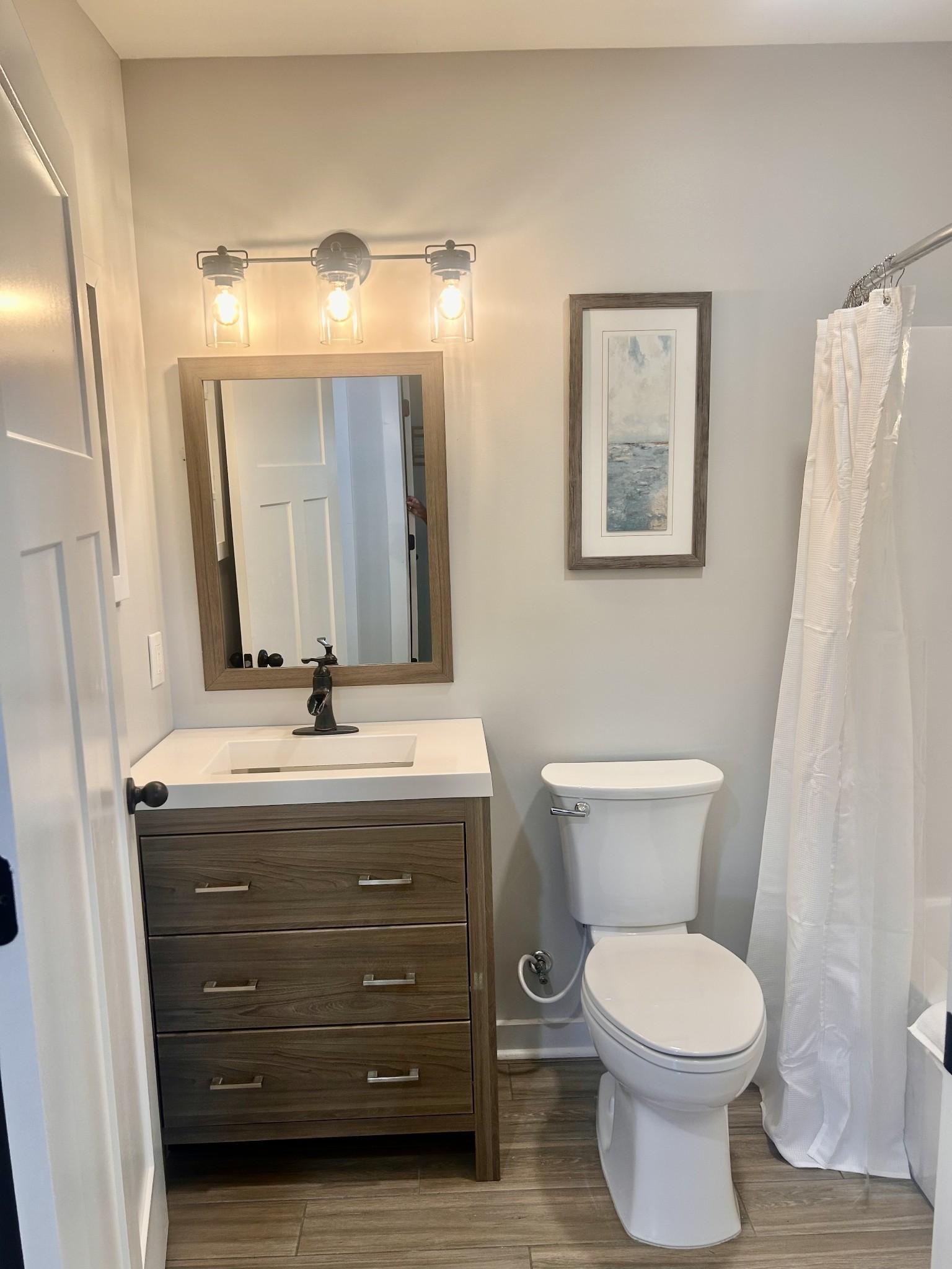 1059 South Cross Bridges Road Mount Pleasant, TN 38474 - Photo 21 of 53 a bathroom with a toilet sink and mirror