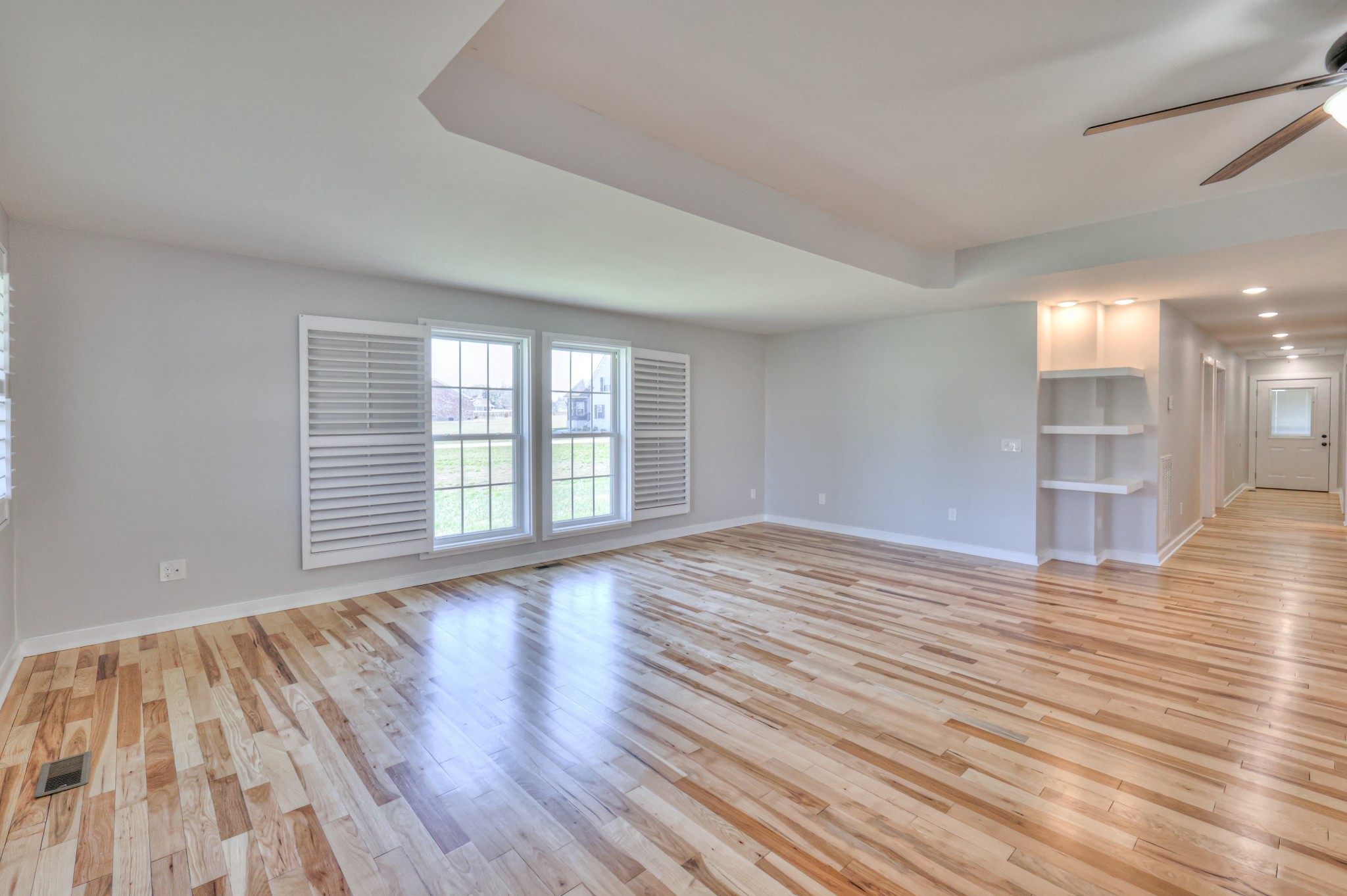 1059 South Cross Bridges Road Mount Pleasant, TN 38474 - Photo 31 of 53 a view of an empty room with wooden floor and a window