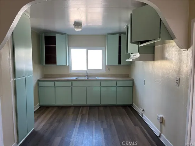a bathroom with a sink and mirror