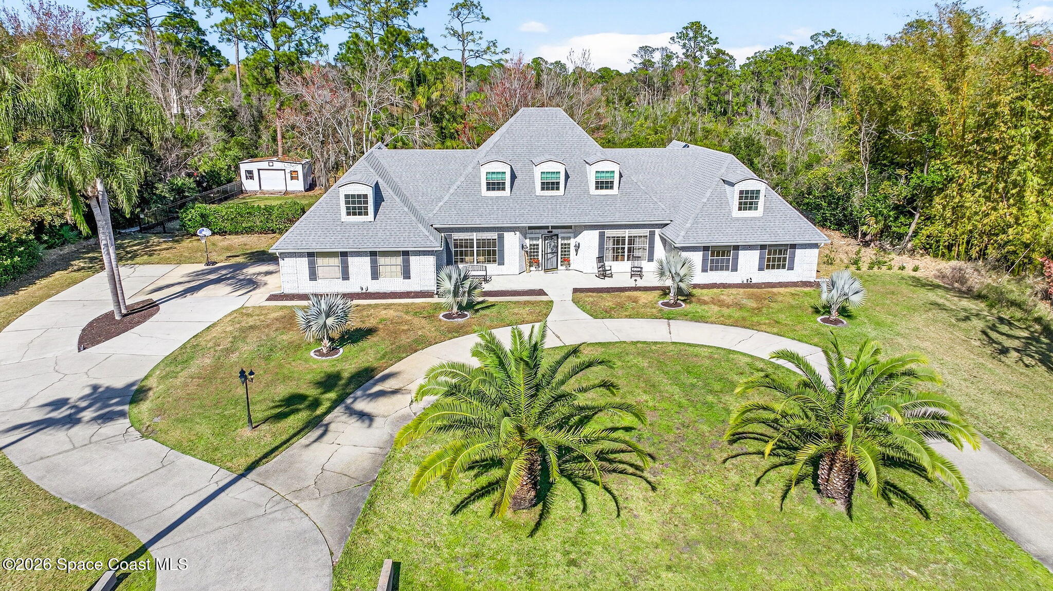 3854 Rambling Acres Drive Titusville, FL 32796 - Photo 2 of 96 DJI_20260127142141_0005_D