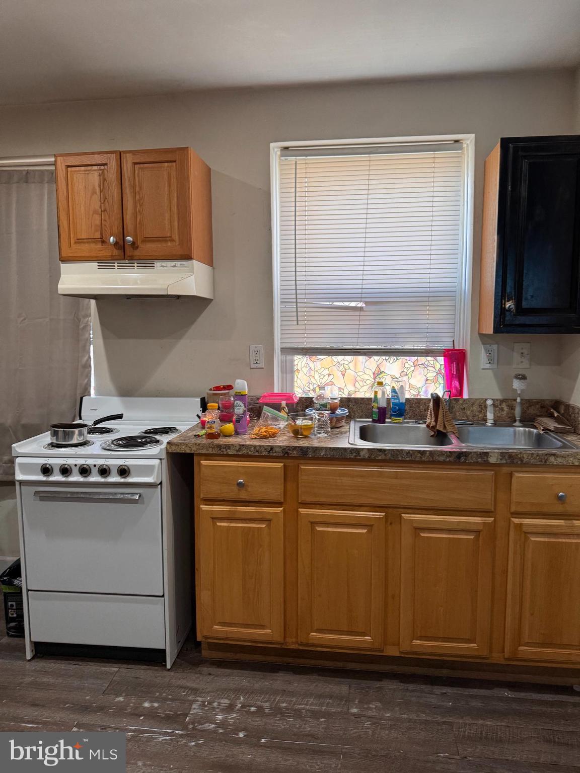 5432 Vine Street, Unit DOWNSTAIRS1 Philadelphia, PA 19139 - Photo 5 of 7 a kitchen with stainless steel appliances granite countertop a sink stove and cabinets