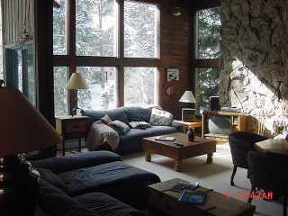 4444 Streamside Circle Vail, CO 81657 - Photo 5 of 8 a living room with furniture and a floor to ceiling window