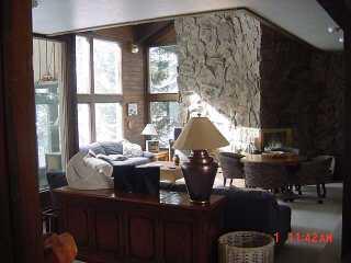 4444 Streamside Circle Vail, CO 81657 - Photo 7 of 8 a living room with furniture and a large window