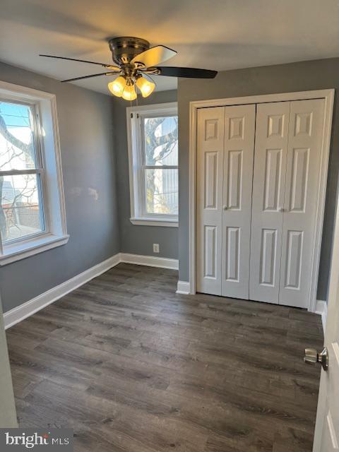 2811 East Venango Street Philadelphia, PA 19134 - Photo 13 of 18 an empty room with wooden floor fan and windows