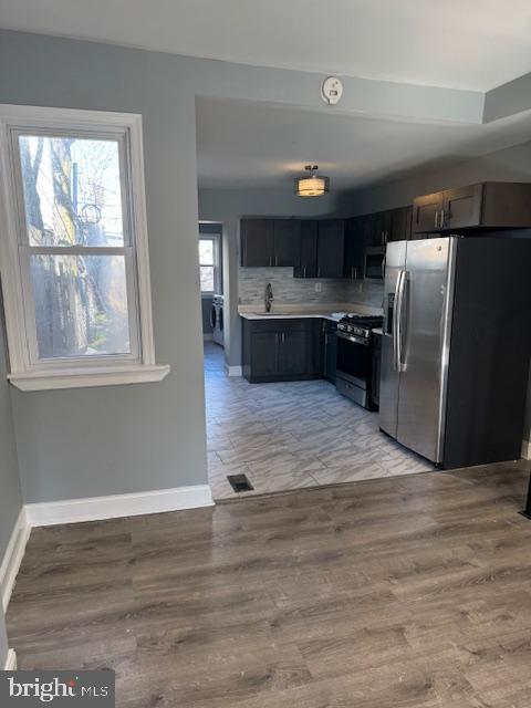 2811 East Venango Street Philadelphia, PA 19134 - Photo 3 of 18 a kitchen with stainless steel appliances a refrigerator sink and stove