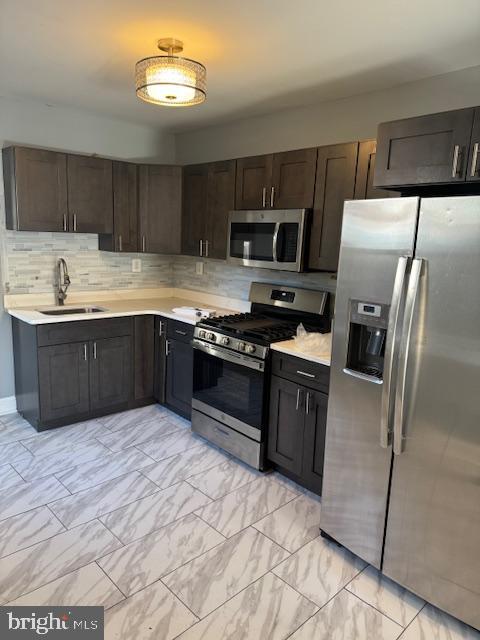 2811 East Venango Street Philadelphia, PA 19134 - Photo 4 of 18 a kitchen with stainless steel appliances granite countertop a sink stove and refrigerator