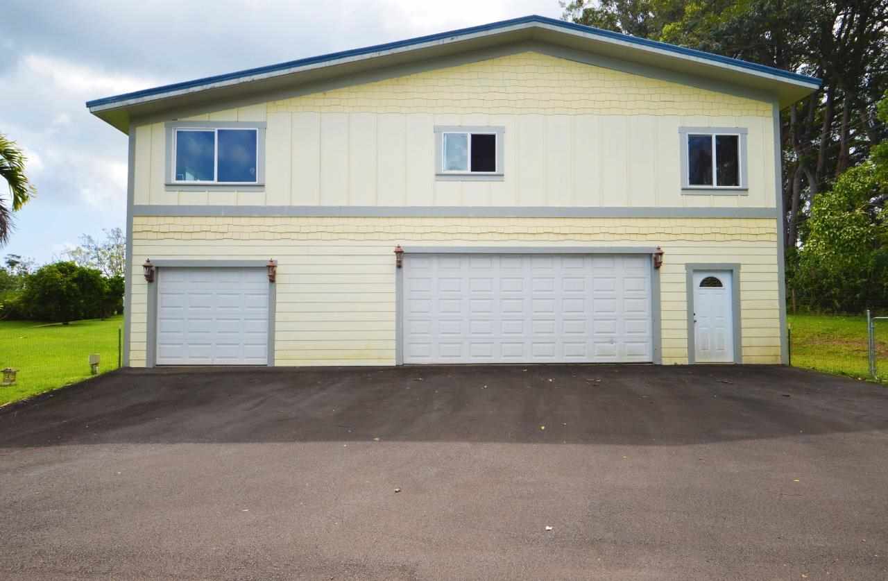 71 Awalau Road Haiku, HI 96708 - Photo 27 of 30 a front view of a house with a yard and garage
