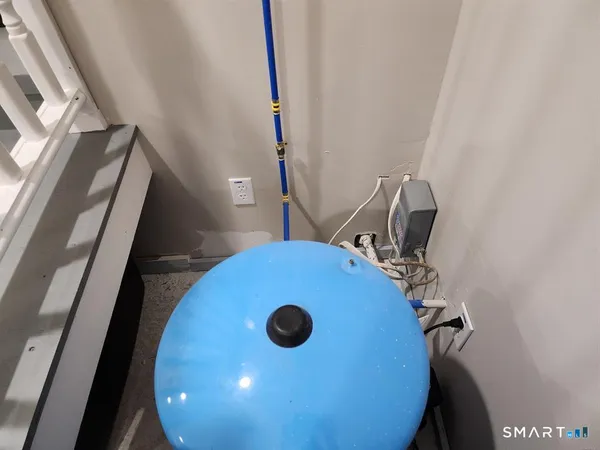 a bathroom with a sink toilet and a mirror