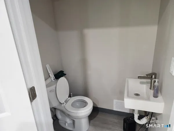 an empty room with a projector and a workspace