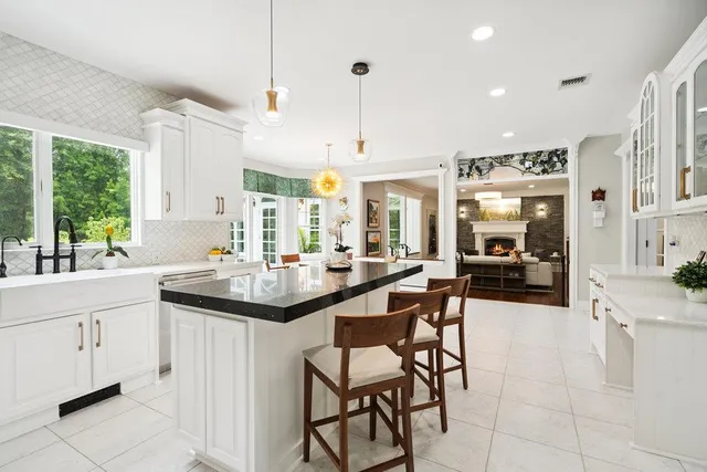 a kitchen with sink cabinets and window