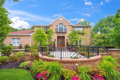 a view of a house with wooden fence