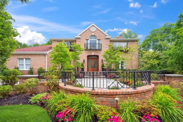 a view of a house with wooden fence