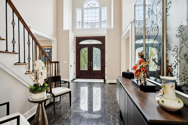 a view of hall way with furniture and rug