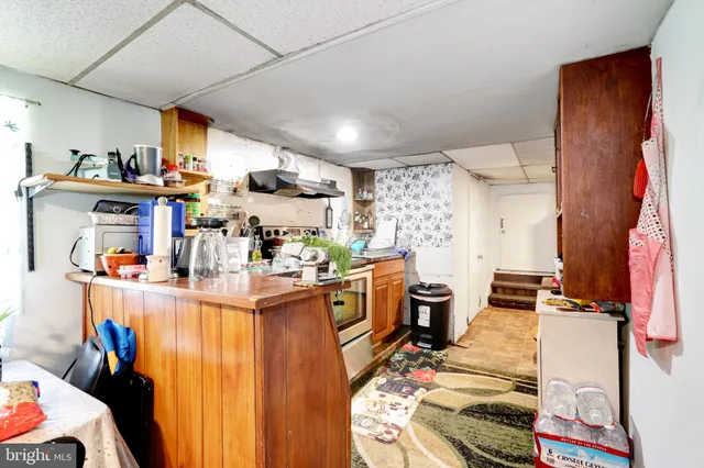 a view of a kitchen with appliances and cabinets