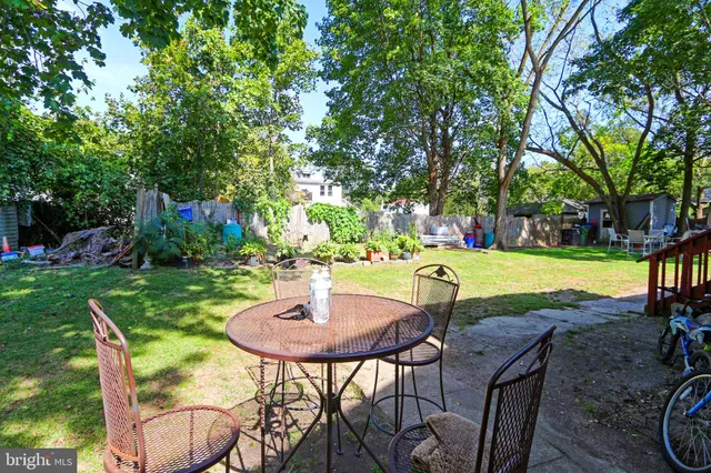a table and chairs in a garden