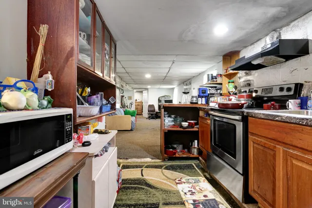 a kitchen with lots of appliances and cabinets