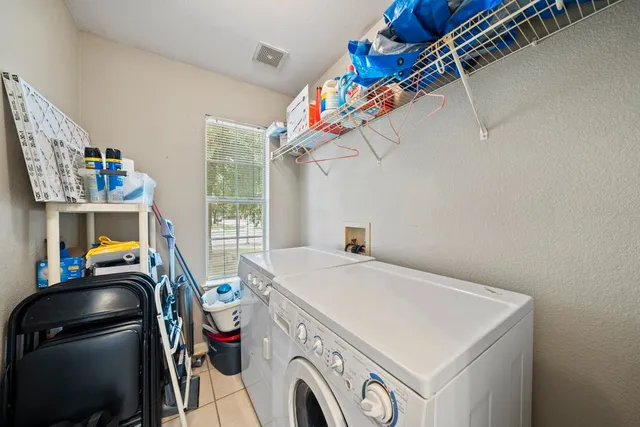a utility room with dryer and washer