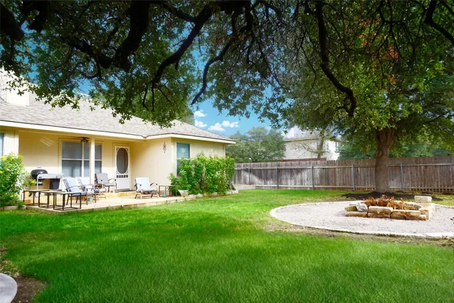a view of a house with a yard porch and sitting area