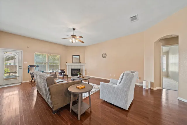 a living room with furniture and a table