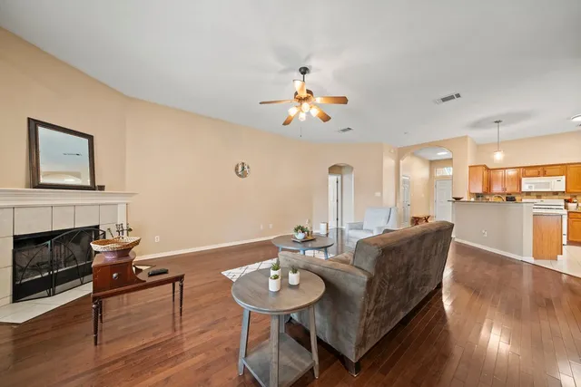 a view of a dining room with furniture wooden floor and chandelier