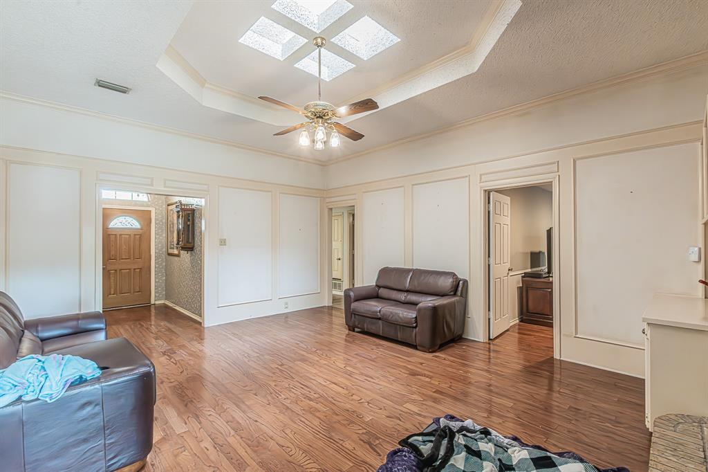 3309 Timber View Circle Bedford, TX 76021 - Photo 31 of 38 a living room with furniture and a chandelier