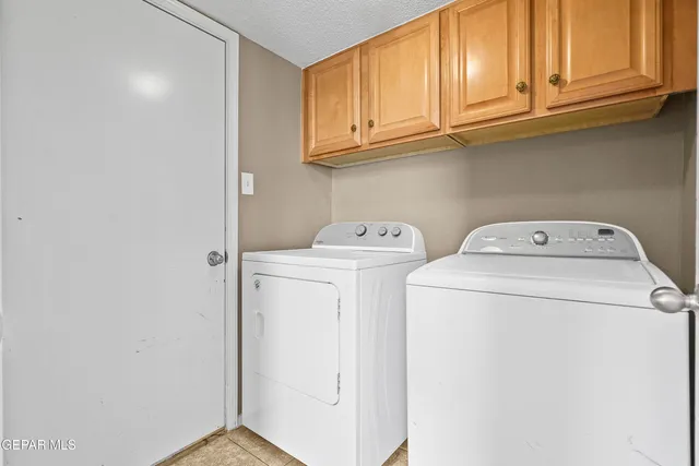 a kitchen with stainless steel appliances granite countertop a stove sink and cabinets