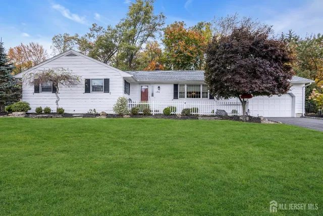 an aerial view of residential house with pool and yard