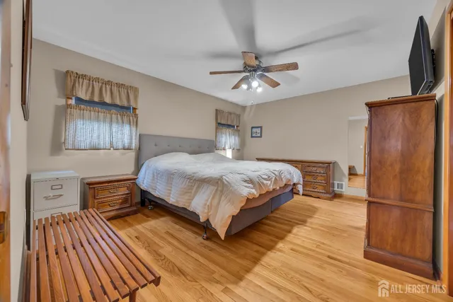 a dining room with furniture a chandelier and glass door