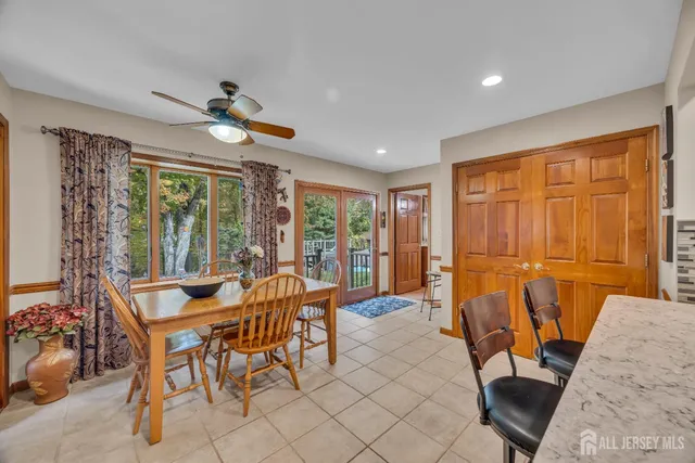 a view of a dining room with furniture wooden floor and chandelier