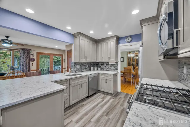 a living room with furniture and a rug