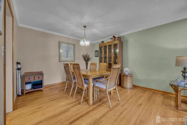 a living room with a bed furniture and a window
