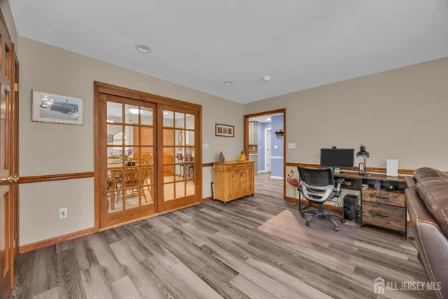 a view of a backyard with a garden and trees