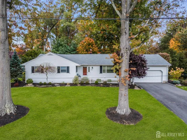 a view of a patio with couches table and chairs with garden