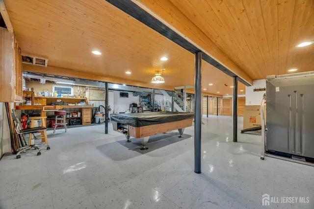 a bedroom with a bed and windows