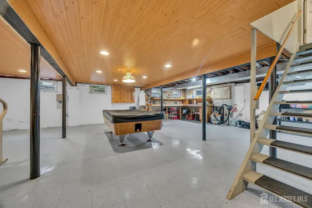 a bathroom with a granite countertop sink a toilet and bathtub