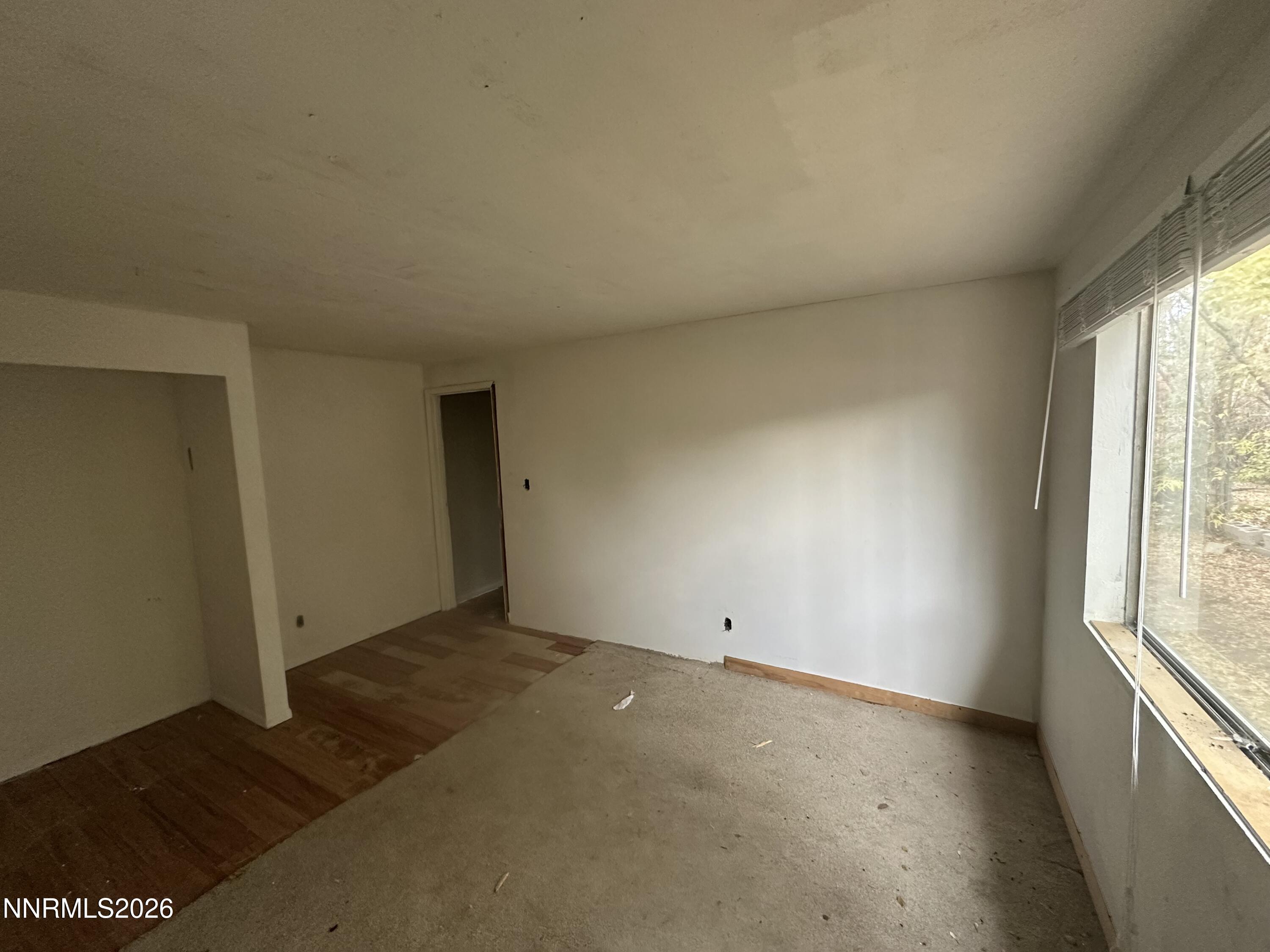 28 Arndell Way Sparks, NV 89431 - Photo 6 of 7 an empty room with wooden floor and windows