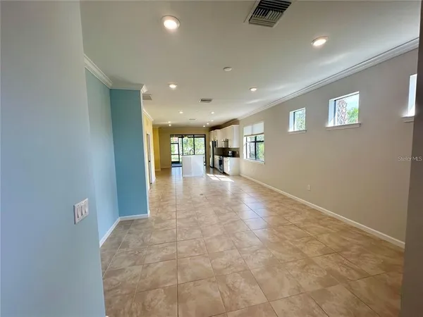 an entryway in a hall with a window