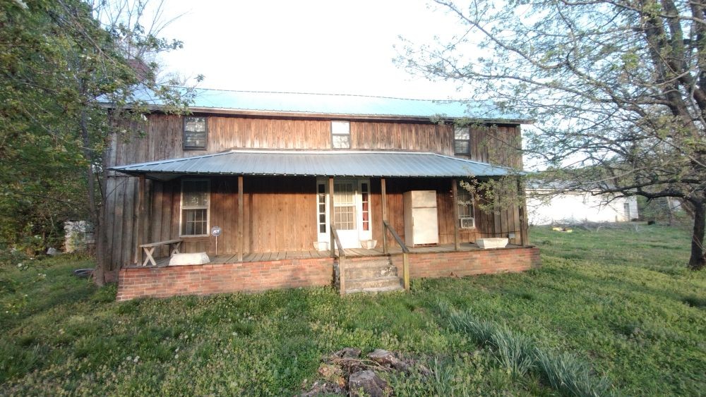 295 State Highway 48 Centerville, TN 37033 - Photo 6 of 80 front view of a house with a yard