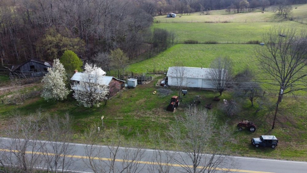 295 State Highway 48 Centerville, TN 37033 - Photo 66 of 80 a backyard of a house with lots of green space