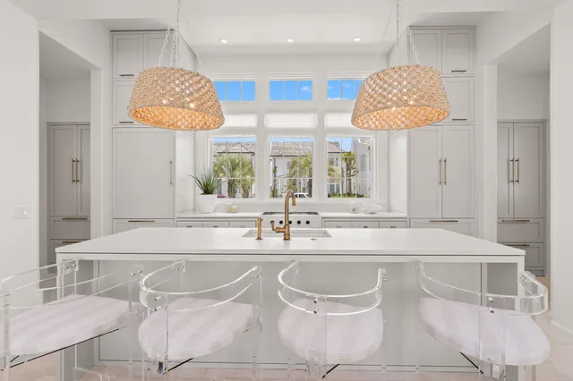 a view of a house with swimming pool and sitting area