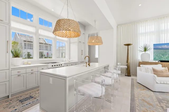 a bathroom with a sink a mirror and a potted plant