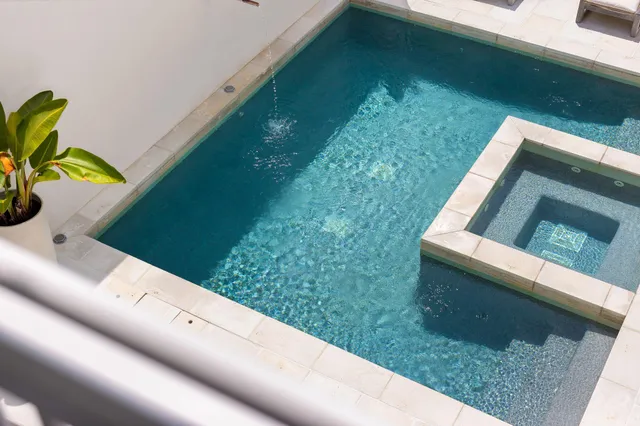 a bathroom with a shower and a window